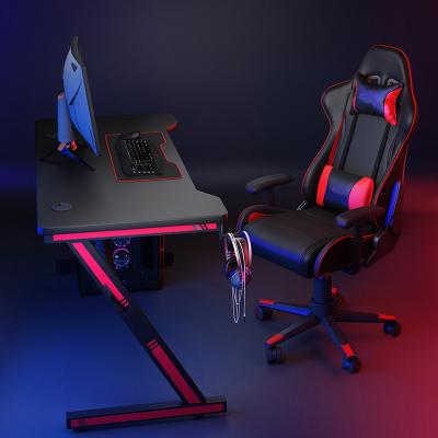 China Simple and modern cheap RGB led lamp gamer table home office PC workstation PC gaming computer z-shaped wrapping steel desk for sale