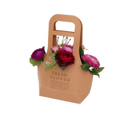 China Recyclable Wholesale Waterproof Handbags Flower Bouquet Packaging Carrier Paper Bag for sale