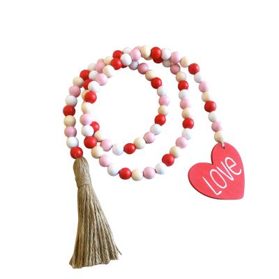 China 100% Handmade Wood Crafts Beads Rustic Tassel Garland Valentine's Day Ornament Heart Decoration Farmhouse Hanging Decor for sale