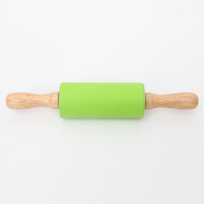 China Amazon Viable Hot Selling Small Size Kitchen Tools Mini Nonstick Silicone Rolling Pin With Wood Handles Backing Dough Roller Tools for sale