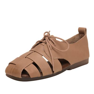 China New Retro Massage Ladies Beach Shoes Lace Up Solid Color Leather Handmade Soft Unique Woven Sandals for sale