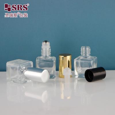 China 6 ml de perfume vacío de forma cuadrada botella de vidrio de rodillo metálico transparente en venta