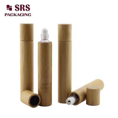 China 15ml real bamboo roller olive oil glass bottle no leakage good massage perfume bottle factory for sale