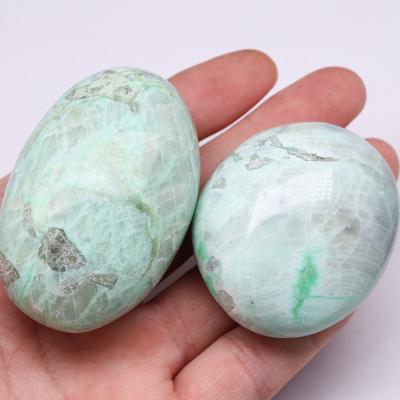 China Wholesale Natural Indian Palm Crystal Pocket Stone Green Moonstone Polished Stone for sale