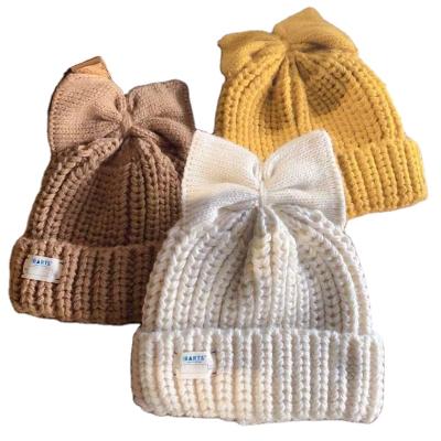 China Autumn and winter soft warm bow women's beige thick knitted woolen hat Japanese and cute cold hat for sale