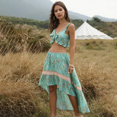 China 2022 Summer New Breathable Bohemian Beach Enyami Sleeveless Crop Top Flouncing Irregular Skirt Women Two Piece Sets for sale