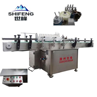 China Food Automatic Hot Melt Glue Wet Round Wine Bottle Labeling Machine for sale