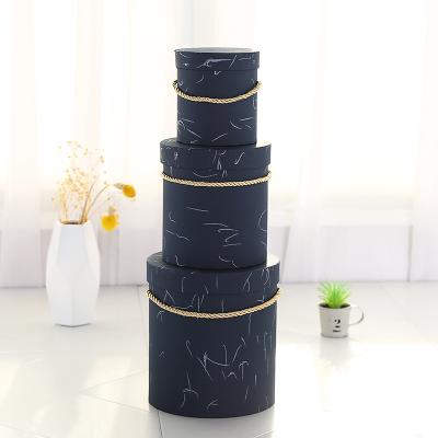 China Customized Handmade Logo Luxury Kraft Paper Round Cylinder Paper Box for sale