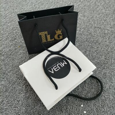 China Hot Selling Recyclable Custom Logo Paper Art Craft Recyclable Paper Bag With Your Own Logo Kraft Paper Suitcase for sale