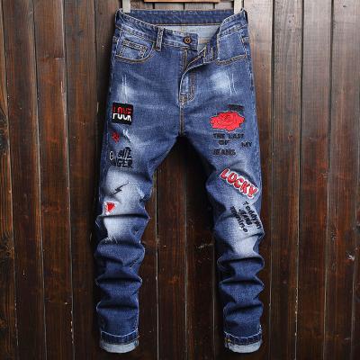 China Viable 2022 New Men's Hot Sale Embroidery Patch Pencil Pants High Elasticity Biker Jeans Slim Personality Print Fitted Pants for sale