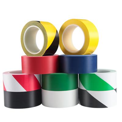 China Design Printing PVC Marking Tape Waterproof Yellow Black Warning Tape For Warehouse Floor for sale