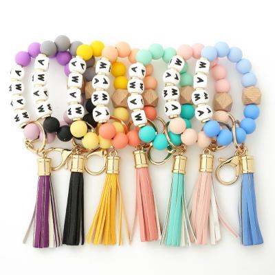 China Amazon Key Chains New Silicone Key Chain Tassel Key Chain Food Grade Silicone Fashionable Pearl Leather Female Wrist for sale