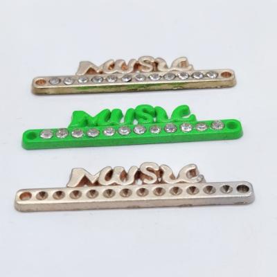 China Zinc Alloy Custom Metal Label Shape Letter Brand Label Eco-friendly Sustainable Metal Label For Garment for sale