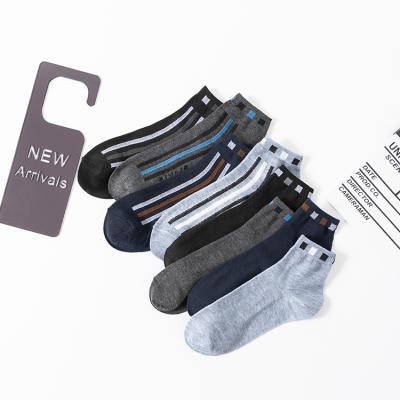 China QUICK DRY men's fashion socks knitted jacquard quilting colorful letter pattern multi style fashionable socks for sale