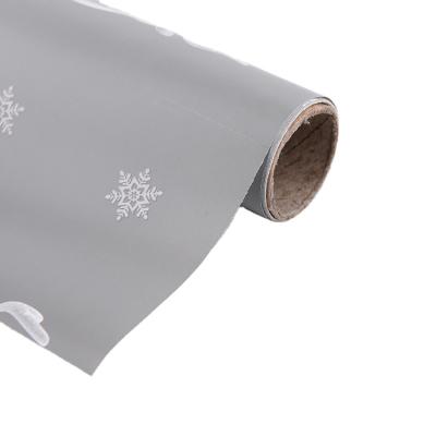 China Greaseproof Makers Directly Sell Dedicated Gray Snowflake Printing Reel Gift Wrapping Paper For Holidays for sale