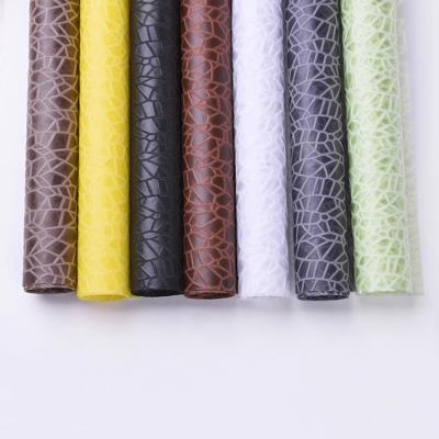 China New Customized Anti-Curvature Embossed Nonwoven Flower Wrapping Paper With Black White Yellow Green Flower Bouquet Supplies for sale