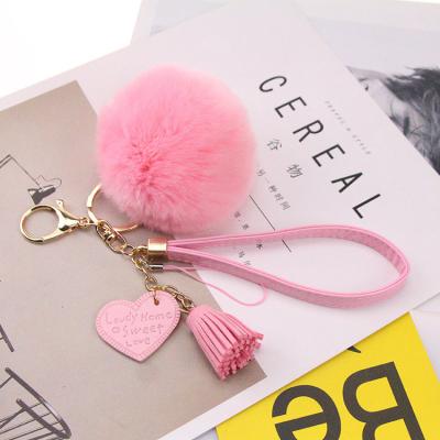 China Women's Heart Shaped Bags Dangle POM POM Custom Tassel Leather Key Chain Hanging Ornaments for sale