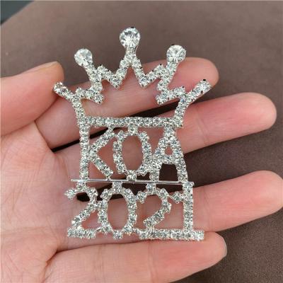 China Brass Crystal Crown Brooch Rhinestone Number Sash Pin For Clothing Accessories for sale