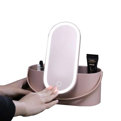 China 2021 SmartWith Hot-selling Elliptical Button Light Custom Portable Handheld Makeup Mirror for sale