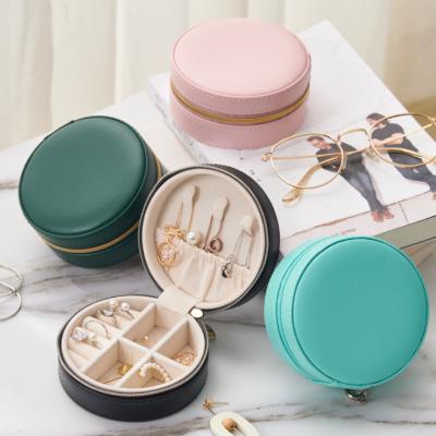 China PU Leather Creative Travel Jewelry Box Earring Jewelry Storage Box Portable Round Leather Hand Jewelry Storage Box for sale