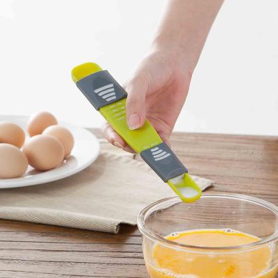 China Measuring Spoon Level Nine Scale Kitchen Ruler Adjustable Spoon Viable Creative Dual Head Scale for sale