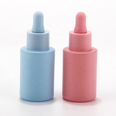 China Fast shipping perfect printing all dropper 30ml serum pink blue glass bottle for oil packaing for sale