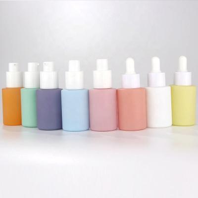 China Perfect Print Rainbow Color 8 Color Glass Storage Bottle With White Pump Spray Dropper Packaging For Essential Oil Custom Color And Logo for sale