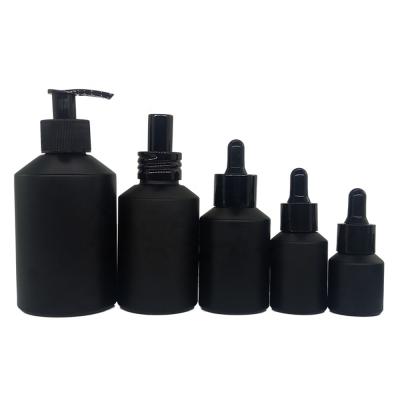 China New Design Cosmetic Black Glass Cosmetic Bottle 15-200ml Bottle With Drop Pump Head for sale