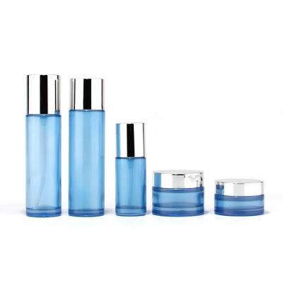 China Cosmetic Wholesale Custom Color Frosted Cosmetic Glass Bottle Sets Glass Jar For Skin Care Face Cream Lotion Bottle for sale