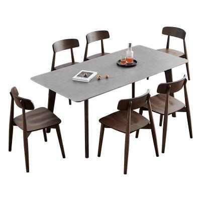 China Solid Scandinavian rock slab dining table and chairs set home simple modern small household Lamina solid wood ash table and chairs for sale