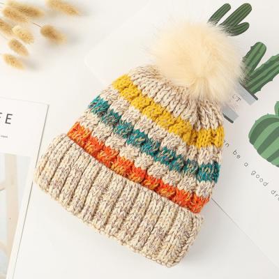 China JOINT Wholesale Custom Logo Hats Winter Warm Stripe Woman Wool Beanie Knit Hats With Pom Pom for sale