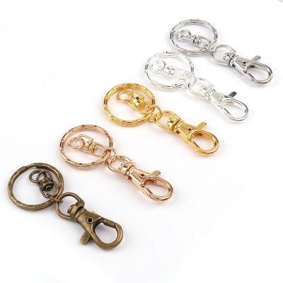 China Viable Wholesale Cheap Metal Wave Gold DIY Circle Key Chain Silvery Black Key Ring For Gift Carabiner Keychain for sale