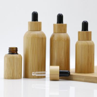 China Black Glass Essential Oil Dropper 5 10 15 20 30 50ML 100ML Cosmetic Bamboo Wood Lid Bottles With Bamboo Lid, Bamboo Essential Oil Bottle for sale