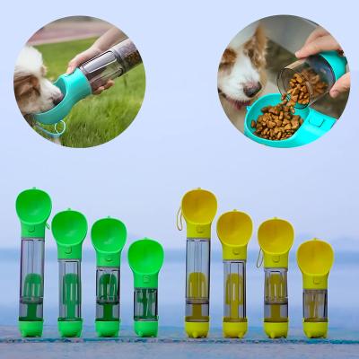 China Viable Wholesale Plastic 4 in 1 Portable Travel Dog Drinking Water Food Bottle with Poop Bag for sale