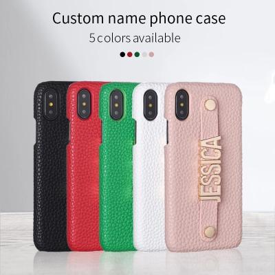 China Shockproof Standing Strap Metal DIY Customization Your Name Pebble Grain Leather Phone Case For iPhone 14 Pro Max for sale