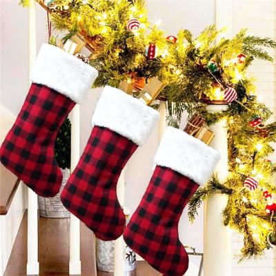 China Non-woven Plaid Fabric Indoor Christmas Stocking Decoration Christmas Decoration Stocking Santa Sock For Kids for sale