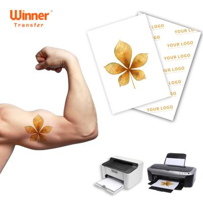 China 100 Sheets Temporary Gold Tattoo Transfer Printing Paper Winner DIY Transfer Custom Package For Body Skin for sale