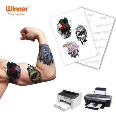 China 100 Sheets Transfer Paper Beaded Tattoo Winner Temporary Transfer Compatible Package For Body Tattoo Paper for sale