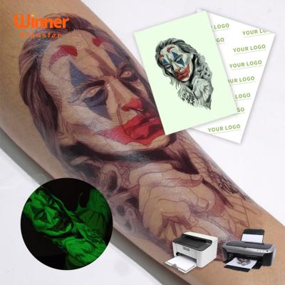 China Temporary Tattoo On Skin OEM Logo Tattoos Paper Glow In Custom Dark Tattoo Paper Glow In Stickers A4 A3 For Inkjet And Laser Printers for sale