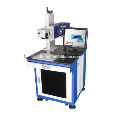 China 50KHz 10W Plastic CO2 Laser Marker Machine Online Flying Printing Cloth Te koop