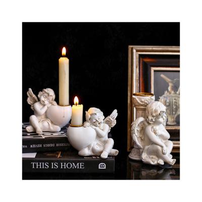 China European Retro Home Decor Resin Cupid Angel Candlestick Atmosphere Decoration Interior Pieces Home Decorations Candle Holder For Home Decor for sale