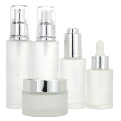 China High Quality Skin Care Packaging Set Plastic Pump Bottle Frosted Glass Jar With Milk White Plastic Lid for sale