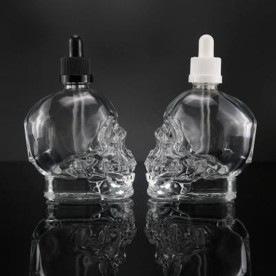 China Wholesale 30Ml High Quality Empty Skull Shape Glass Bottle Single Empty Glass Bottle for sale