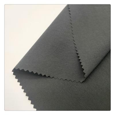 China Hot selling stretch 88% nylon 12%spandex plain dyed stretch fabric four way woven fabrics for garment for sale