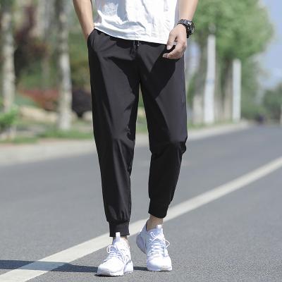 China new Anti-wrinkle summer slacks for men, loose, quick-drying, ice silk, breathable, nine-minute stretch sweatpants, Harlem pants for sale