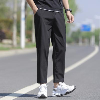 China new Anti-wrinkle summer slacks for men, loose, quick-drying, ice silk, breathable, nine-minute stretch sports pants for men for sale