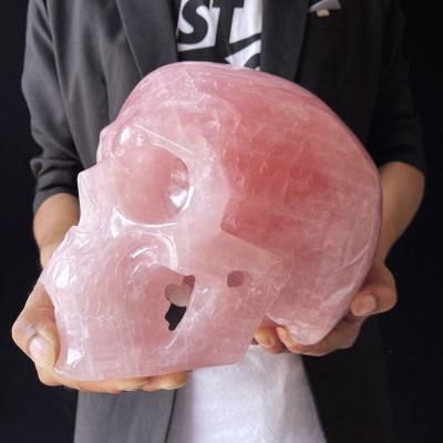 China Europe 11.5kg High Quality Gemstone Skulls Hollow-carved Large Life Size Natural Rose Quartz Crystal Skulls for sale