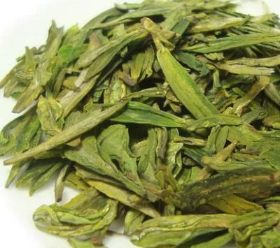 Κίνα Υγιές οργανικό χειροποίητο τσάι Longjing δυτικών λιμνών της Κίνας με τη λεπίδα που διαμορφώνεται προς πώληση