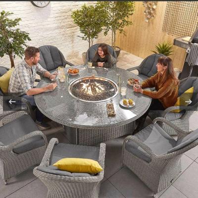 China Modern High Quality Aluminum Frame Rattan Woven Garden Furniture Patio Table With Outdoor Fire Pit Table And Chair Set for sale