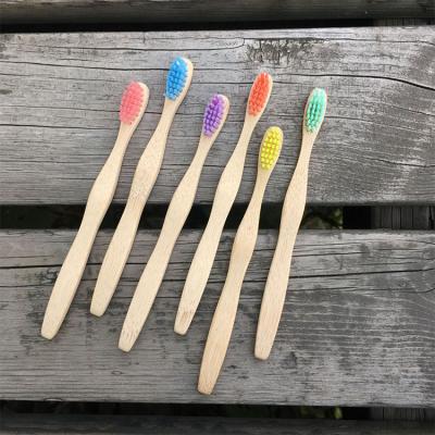 China Light and Comfortable Toothbrush Bamboo Charcoal Handle Wooden Toothbrush for Kids Children Custom Logo for sale